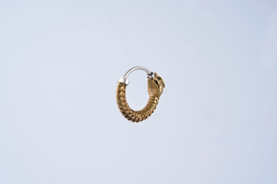 Gold hoop earrings on a clean background