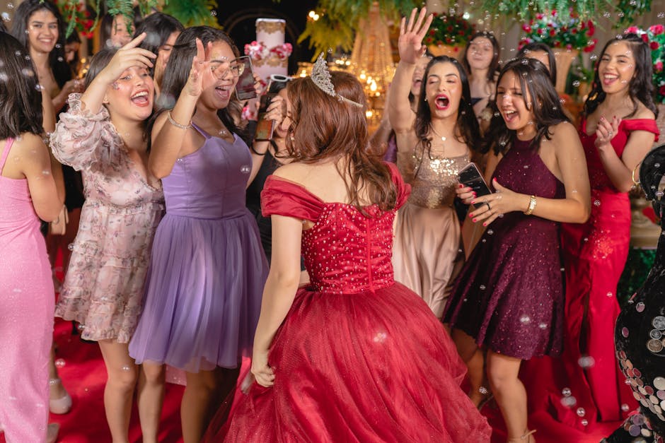 Group of teenage girls enjoying a festive party with elegant dresses and joyful expressions.